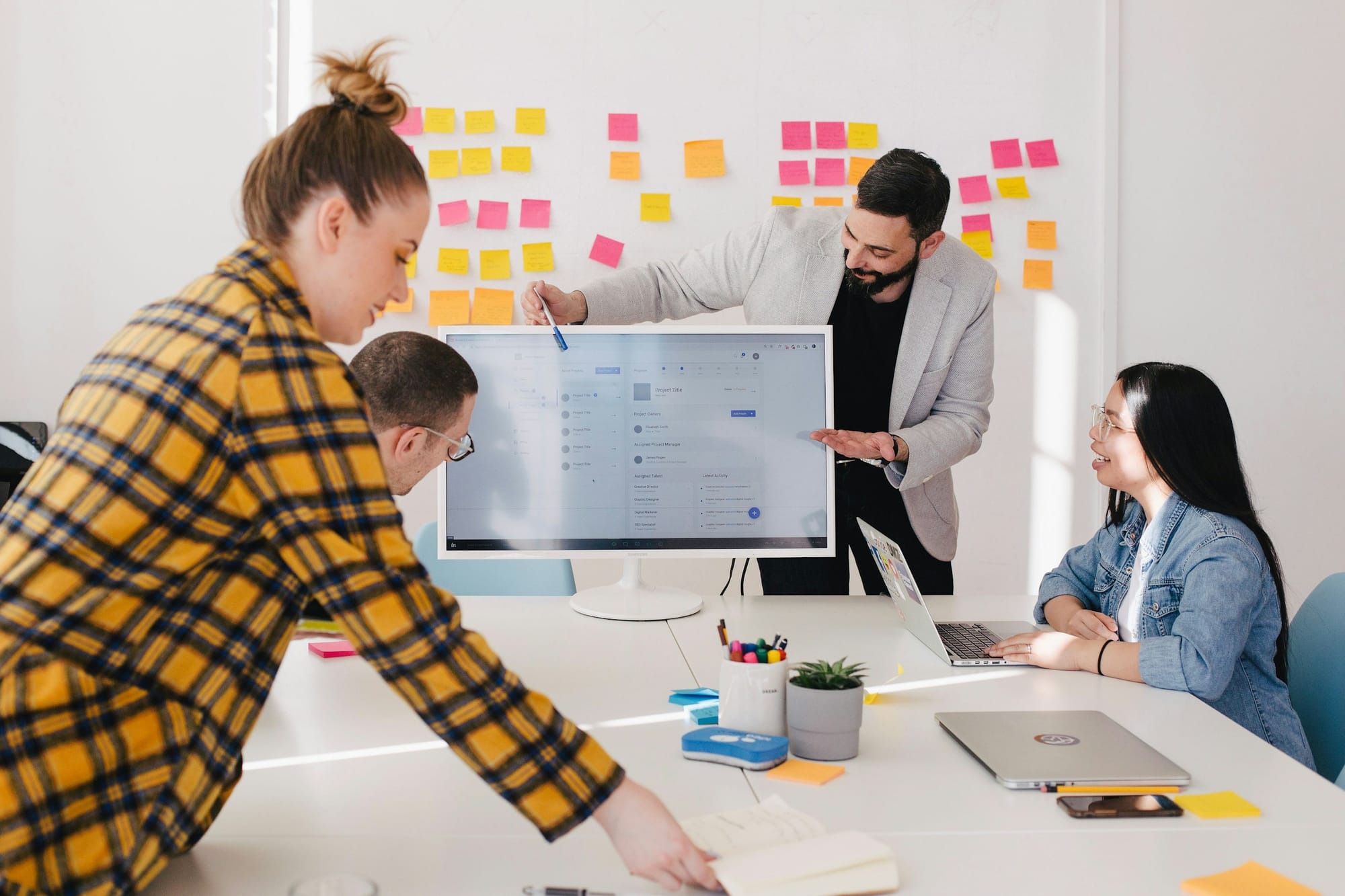 Man Presenting in a Meeting - How to Manage Multiple Calendars