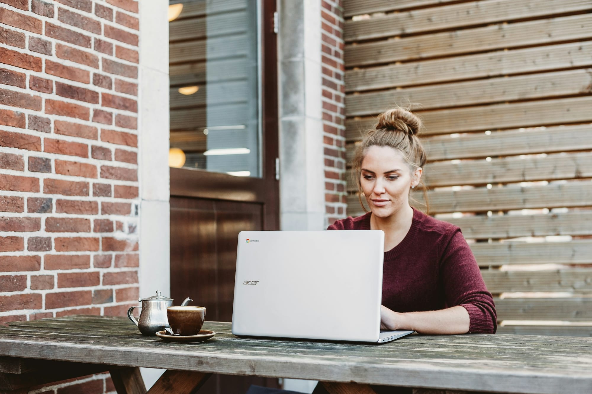 Woman Using Laptop - Skedpal vs Motion