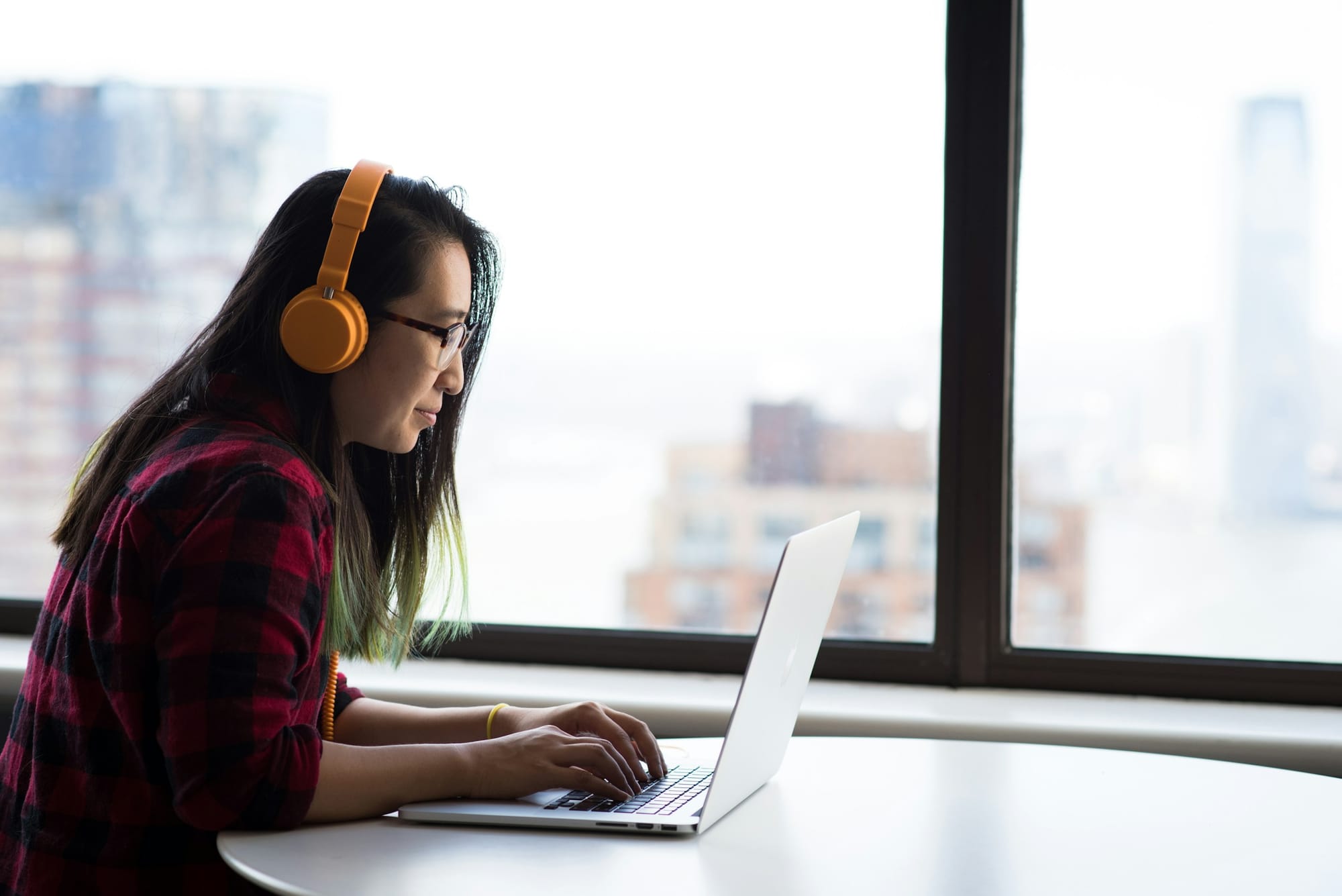 woman using headphones - Executive Calendar Management