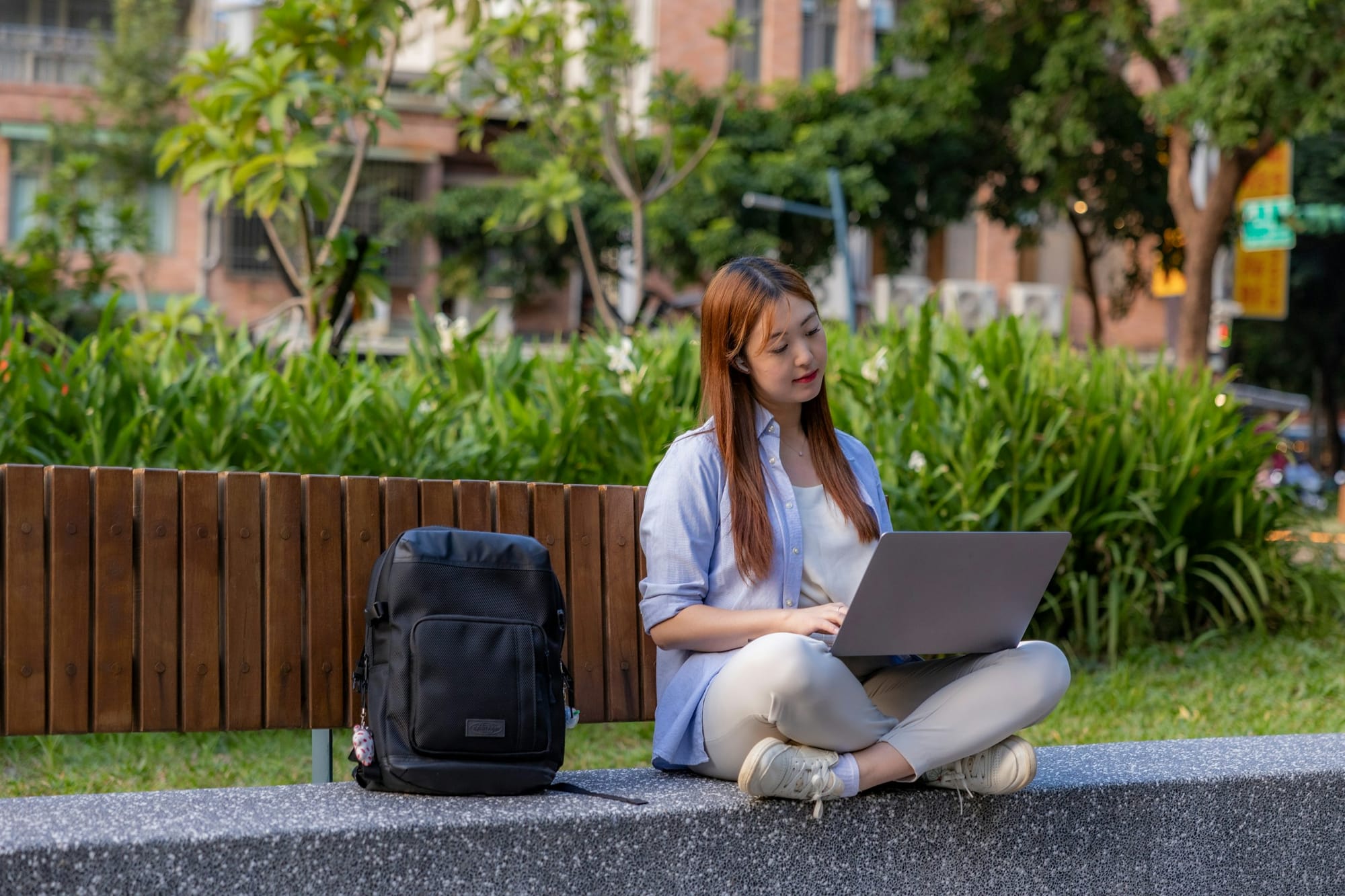 woman sitting with a laptop - How to Use a Calendar Effectively