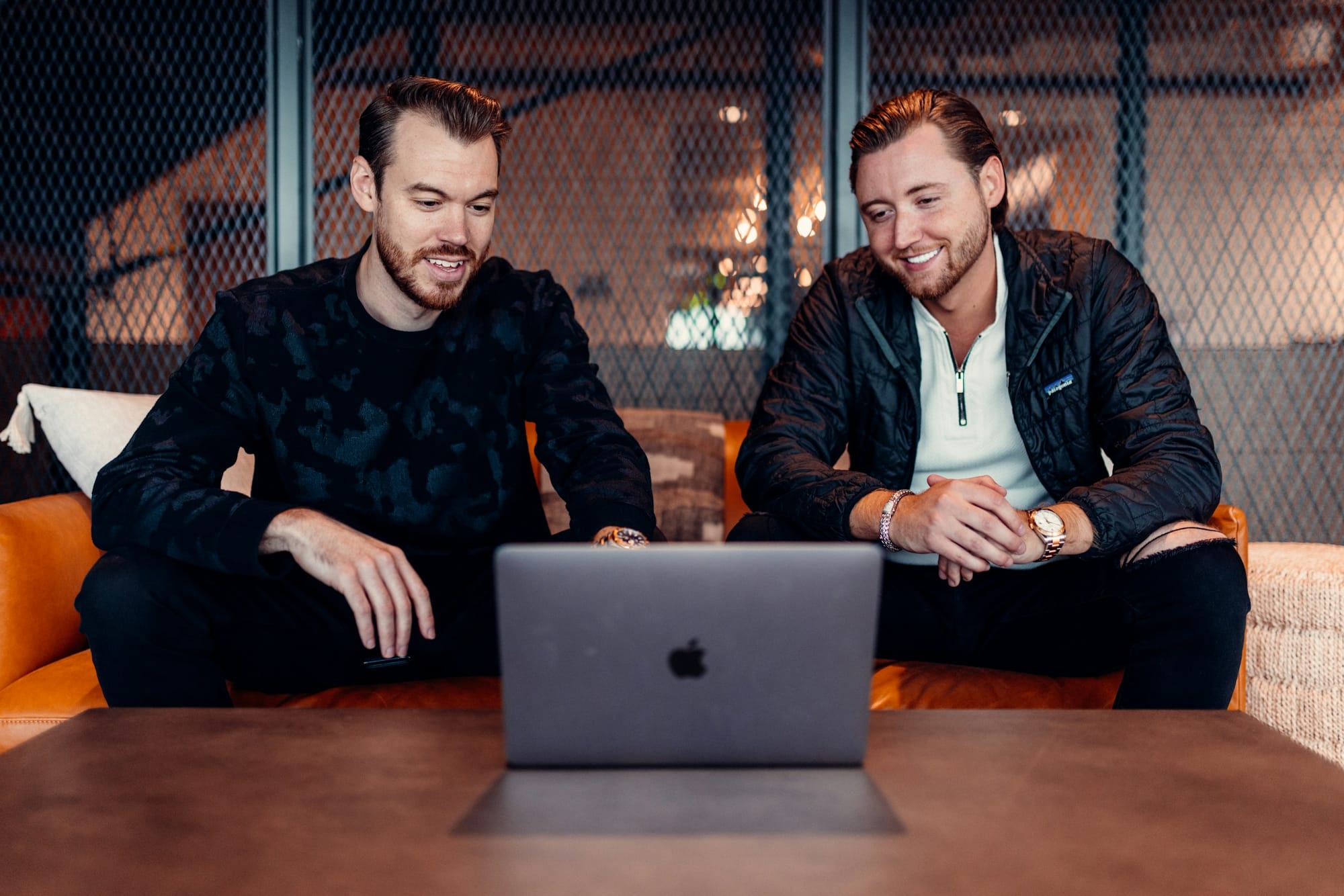 men looking at a laptop - Top Calendar Apps