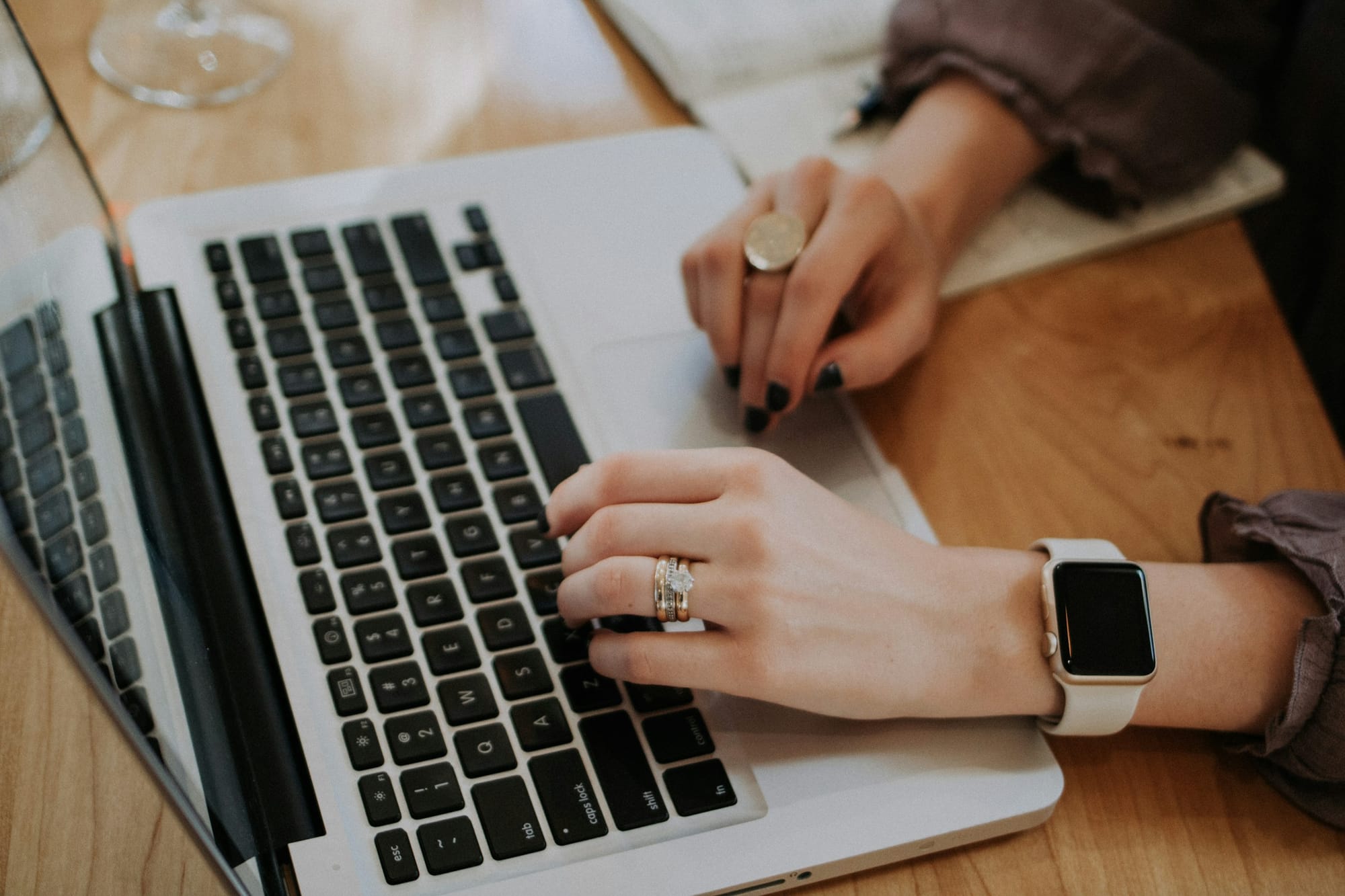 woman typing on a laptop - Google Calendar AI