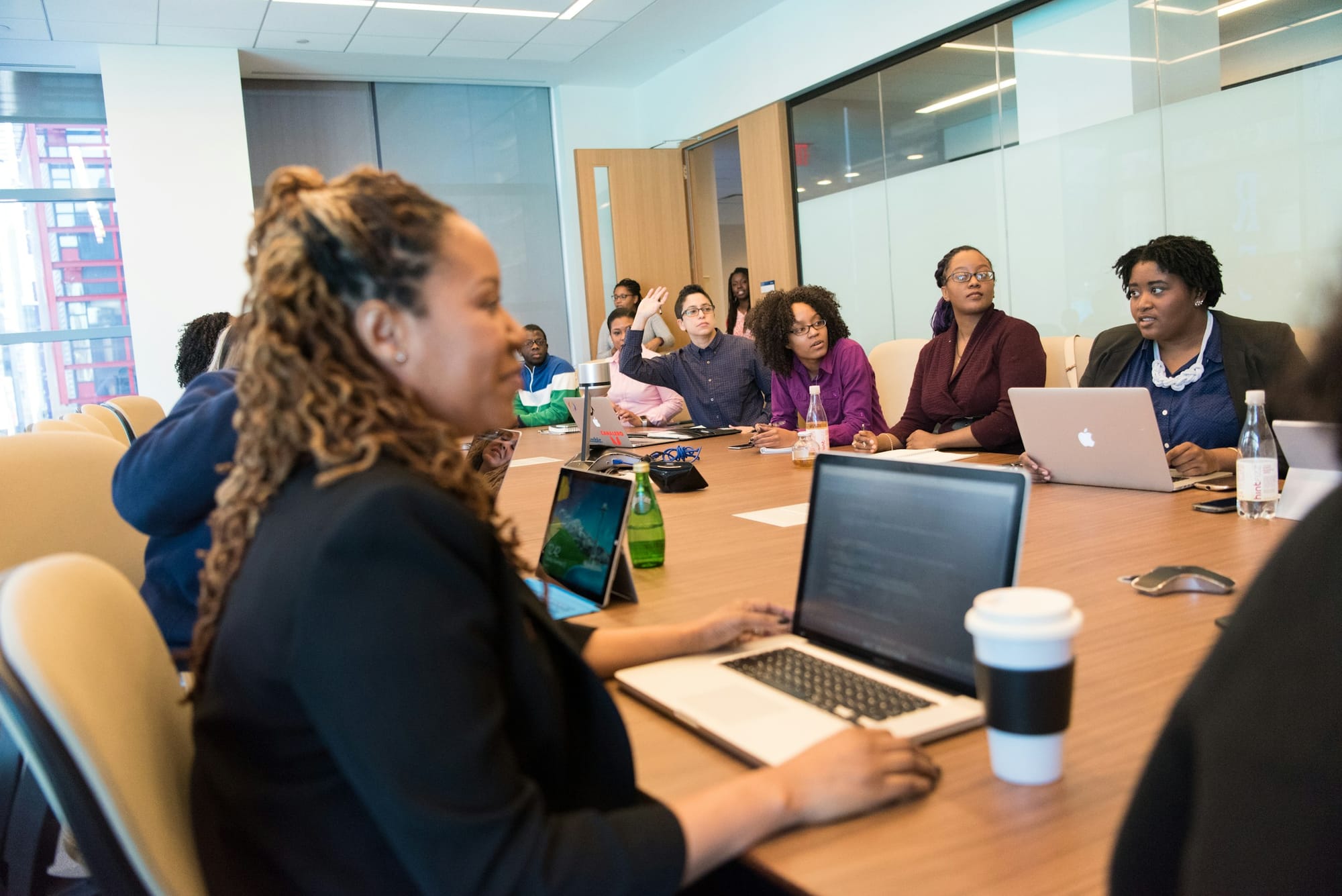 employees in a meeting - AI Staff Scheduling