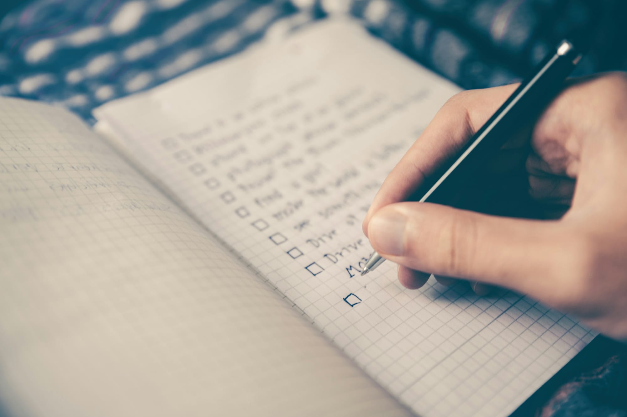 woman writing on a notebook - Automated Reminders