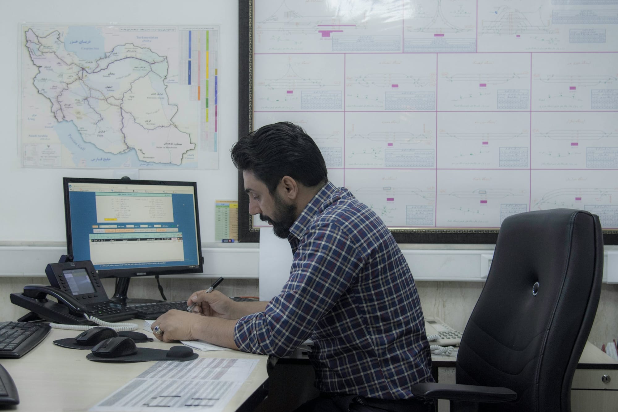 man working in an office - Organizing Calendar