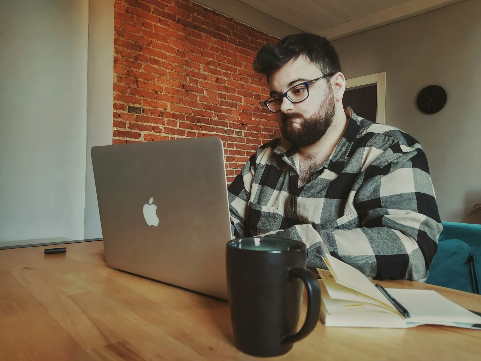 man working on a laptop - Notion vs Motion