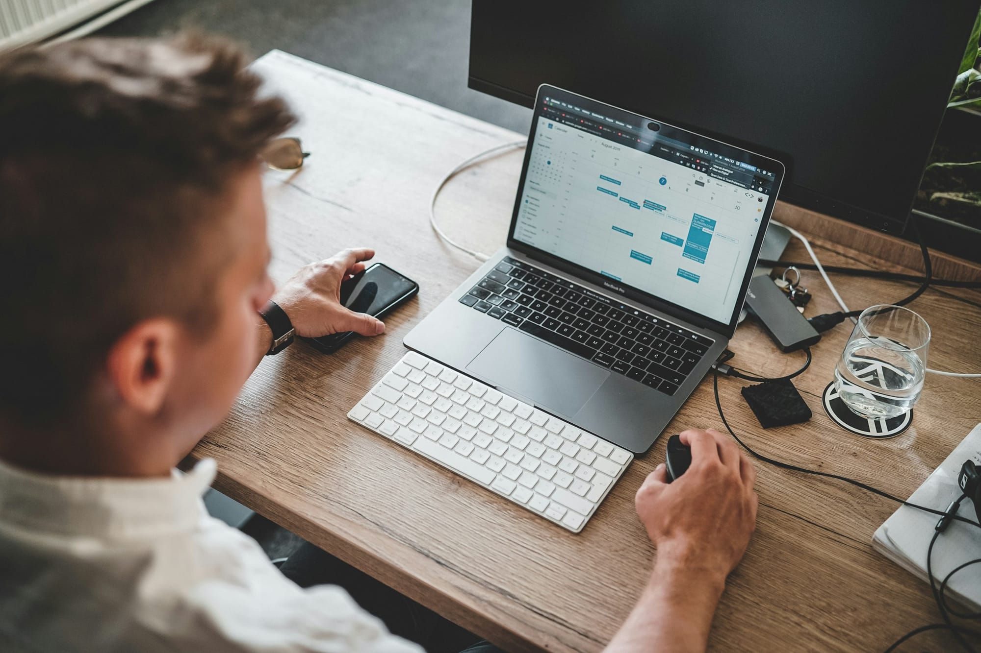 man using a laptop - Calendar Automation