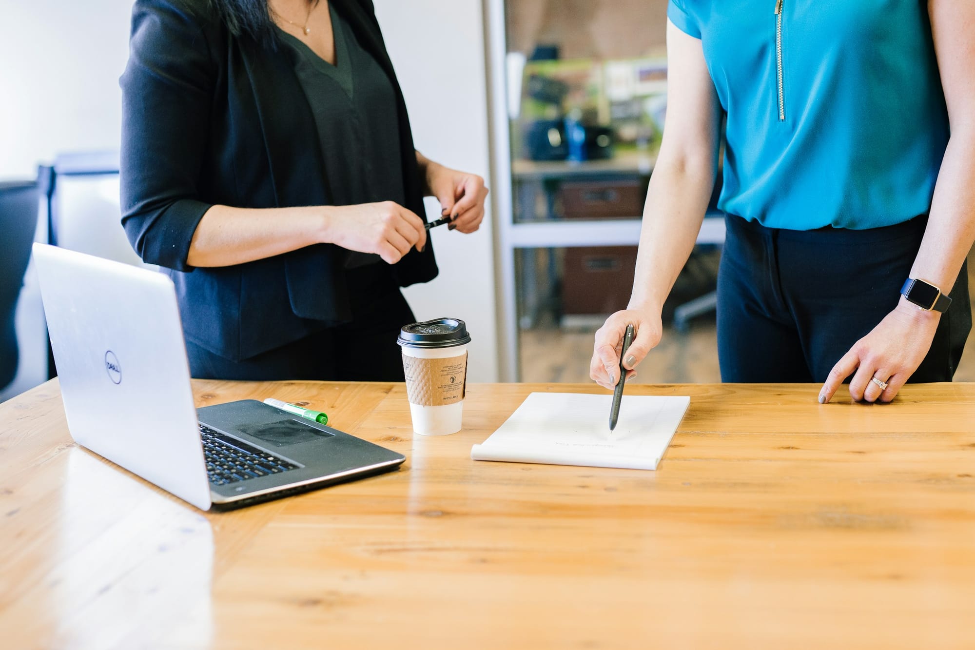 Coworkers in Meeting - Tips for Taking Meeting Minutes