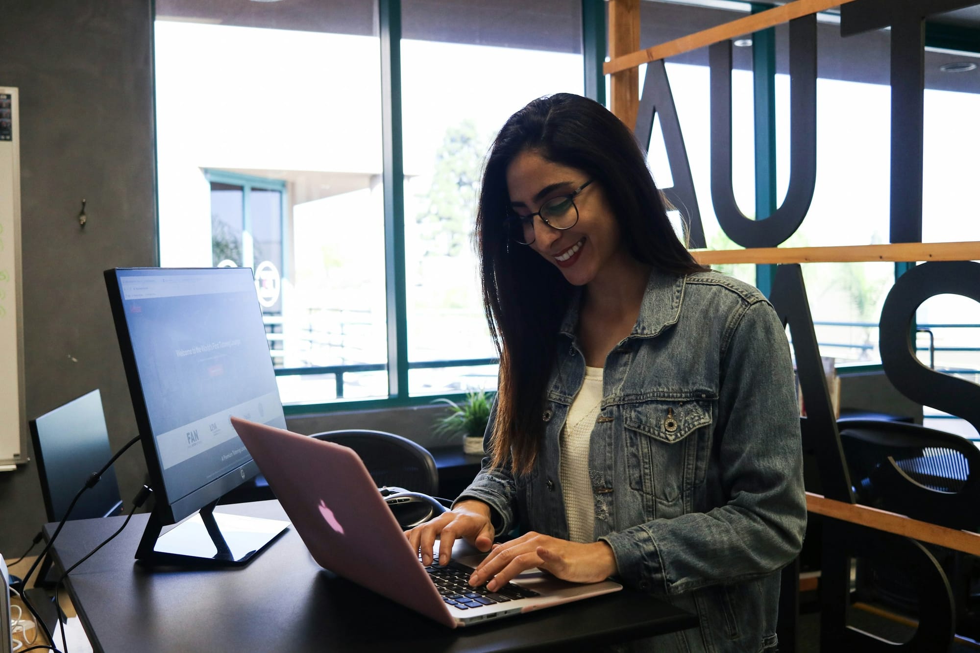 woman smiling - Small Business Productivity Tools