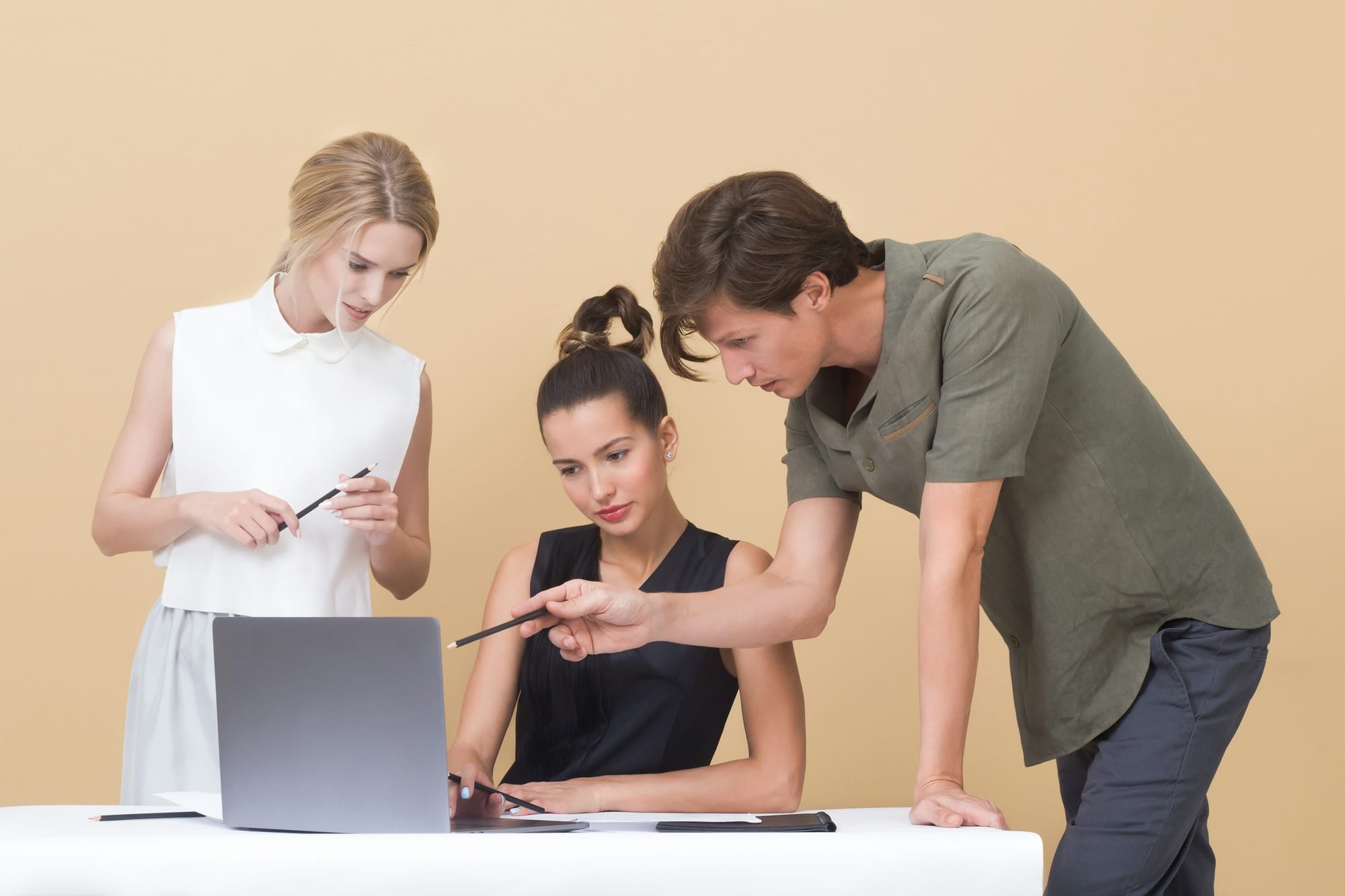 employees on a laptop - Enterprise Productivity Solutions