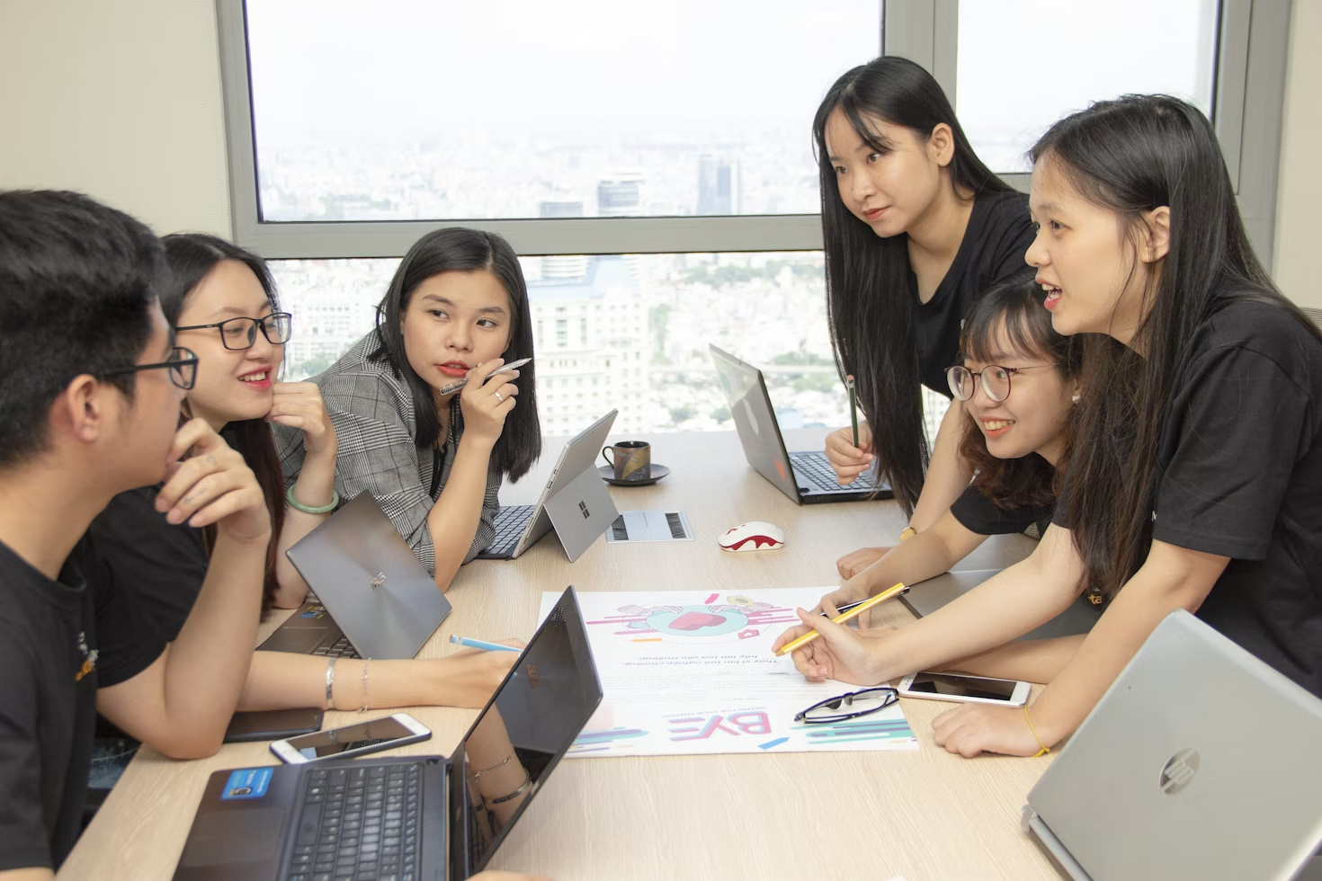 team in an office - Team Productivity Apps