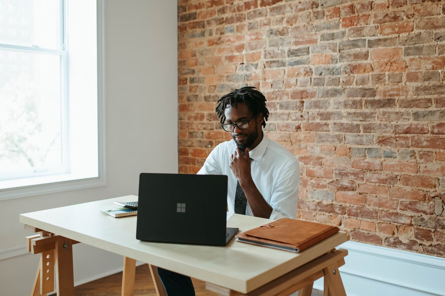 man on a laptop - Small Business Productivity Tools