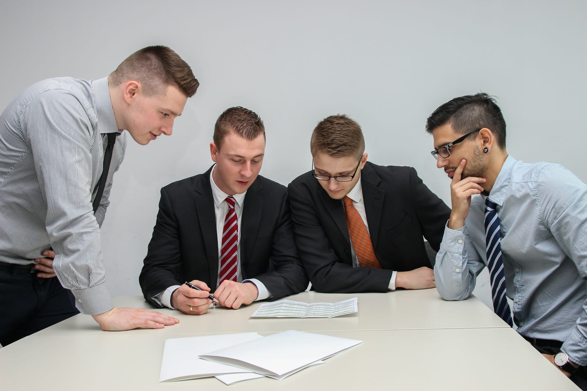 Men Discussing - Tips for Taking Meeting Minutes