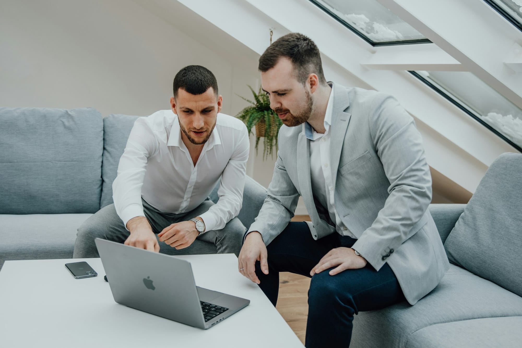 men using a laptop - Small Business Productivity Tools
