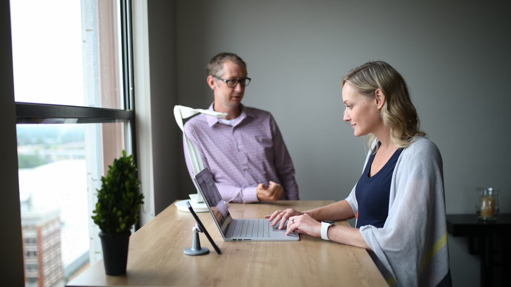 woman using a laptop - How to Prepare Minutes of Meeting