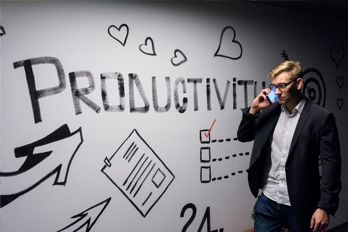 man on a phone - Pyramid Of Productivity