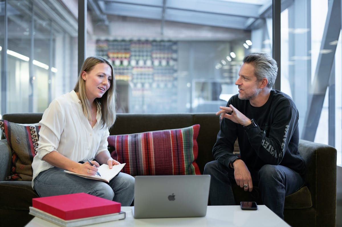 Coworkers Discussing - Tips for Taking Meeting Minutes