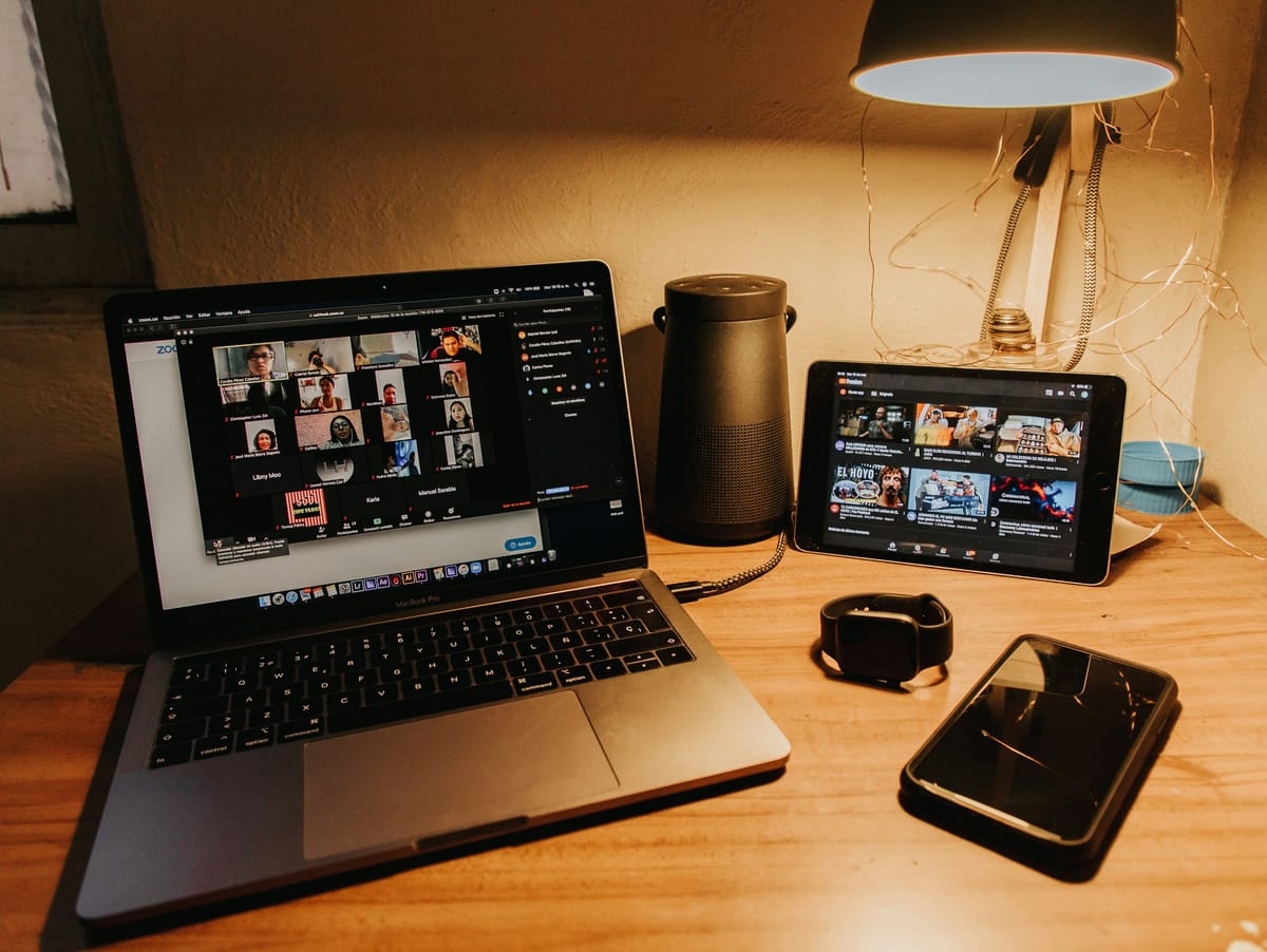 laptop and phone - Best Zoom AI Notetaker